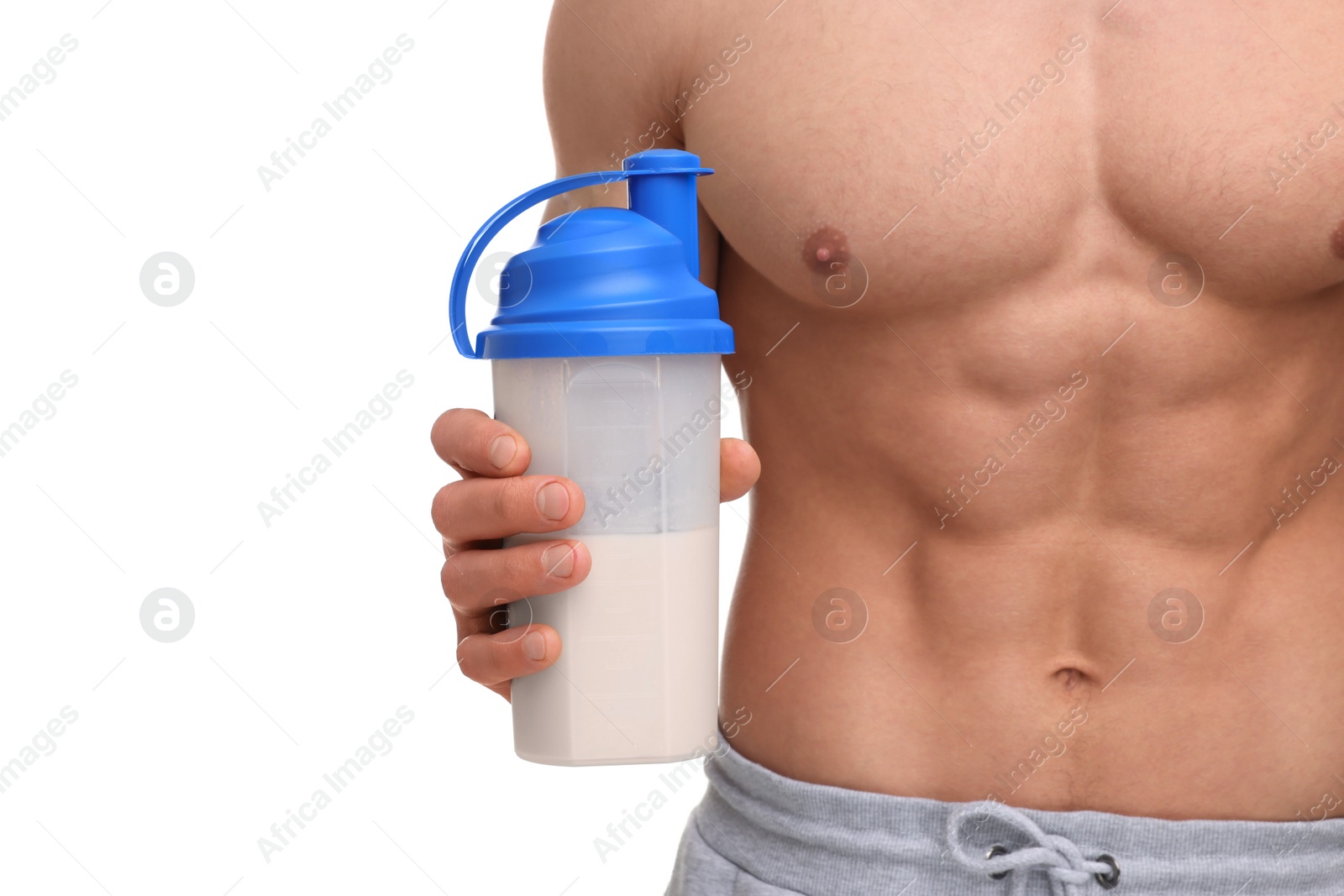 Photo of Young man with muscular body holding shaker of protein on white background, closeup
