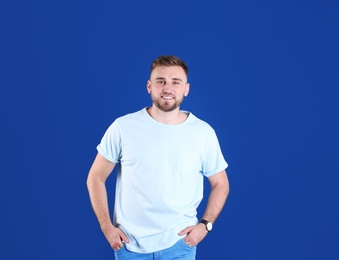 Photo of Portrait of handsome happy man on color background