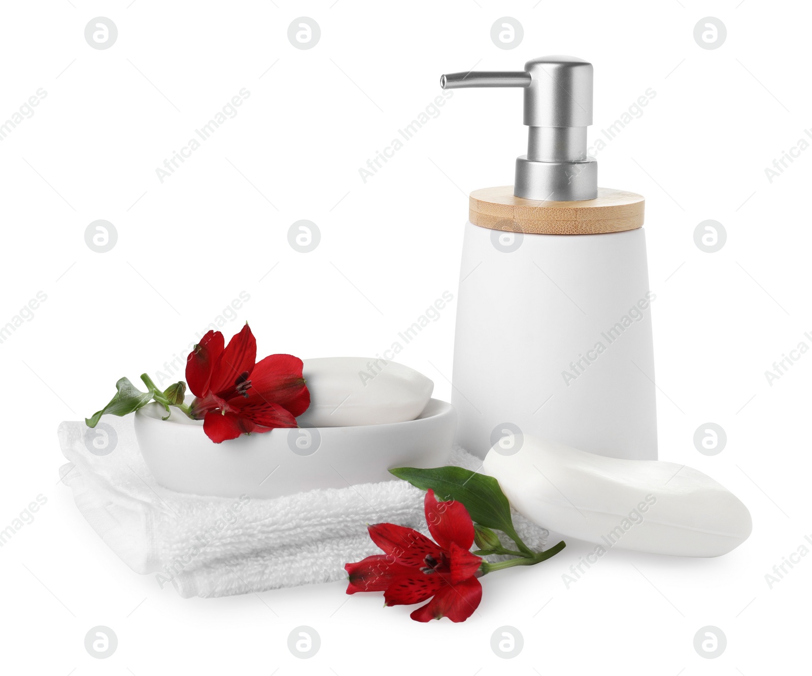 Photo of Soap bar, dispenser and terry towel on white background