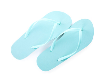 Photo of Light blue flip flops isolated on white. Beach accessory