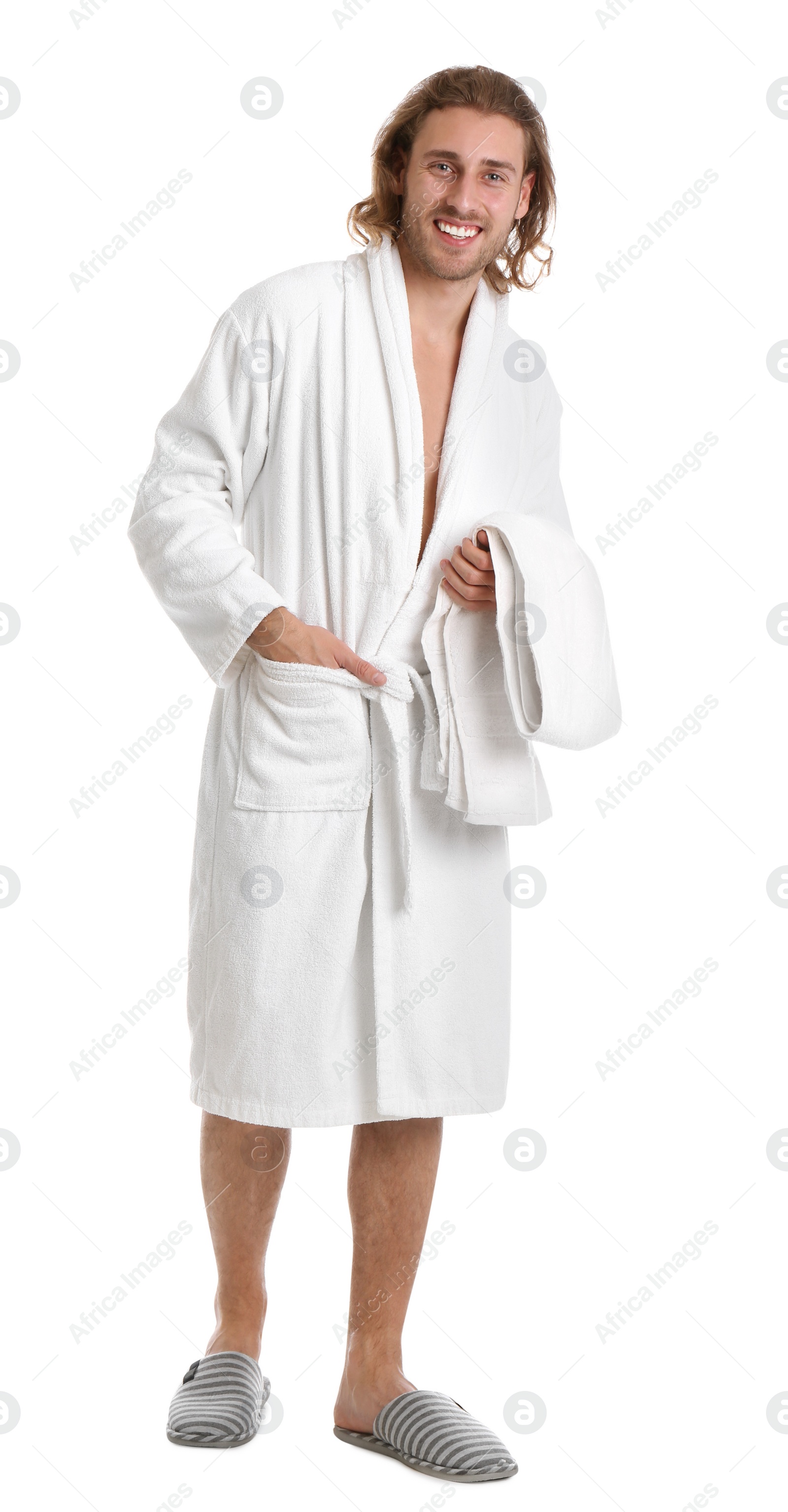 Photo of Young man in bathrobe with towel on white background