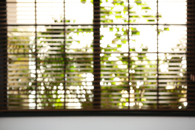 Photo of Blurred view through window on garden in morning