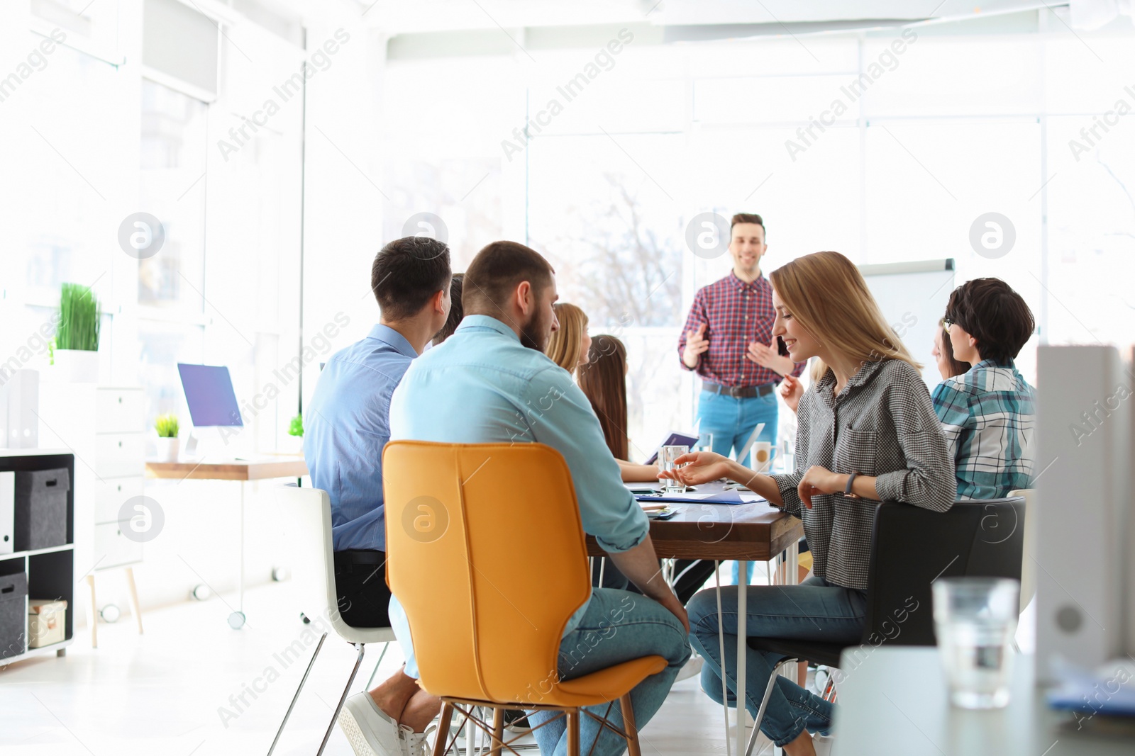 Photo of Male business trainer giving lecture in office