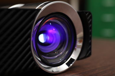 Closeup view of modern digital video projector on table