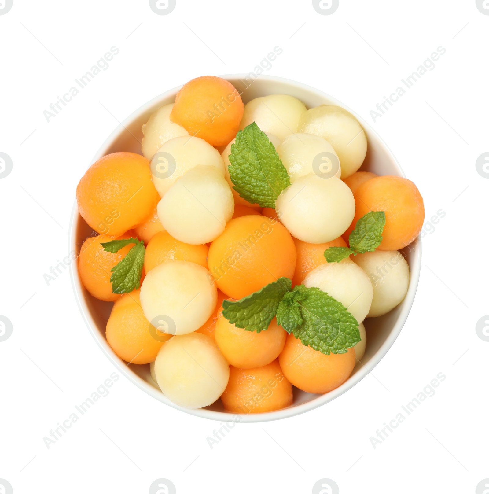 Photo of Melon balls and mint in bowl isolated on white, top view