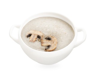 Photo of Delicious mushroom cream soup in bowl isolated on white