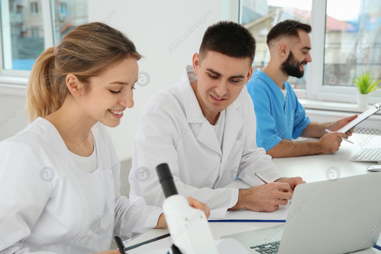 Photo of Medical students working in modern scientific laboratory