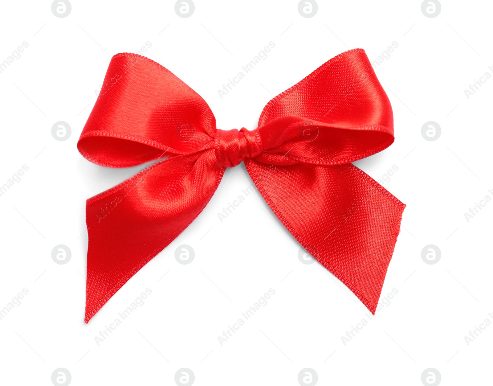 Photo of Red ribbon bow on white background, top view