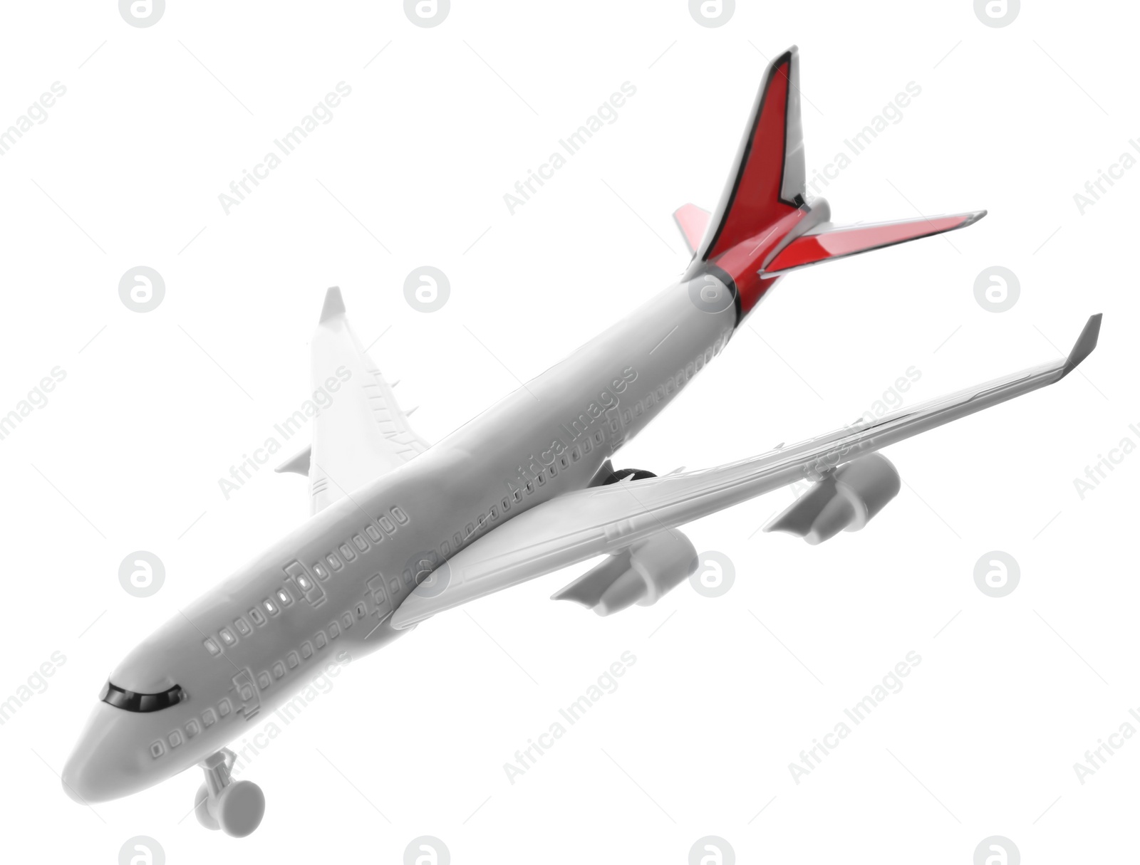 Photo of Toy airplane isolated on white. Travel concept