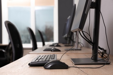 Photo of Many modern computers in open space office