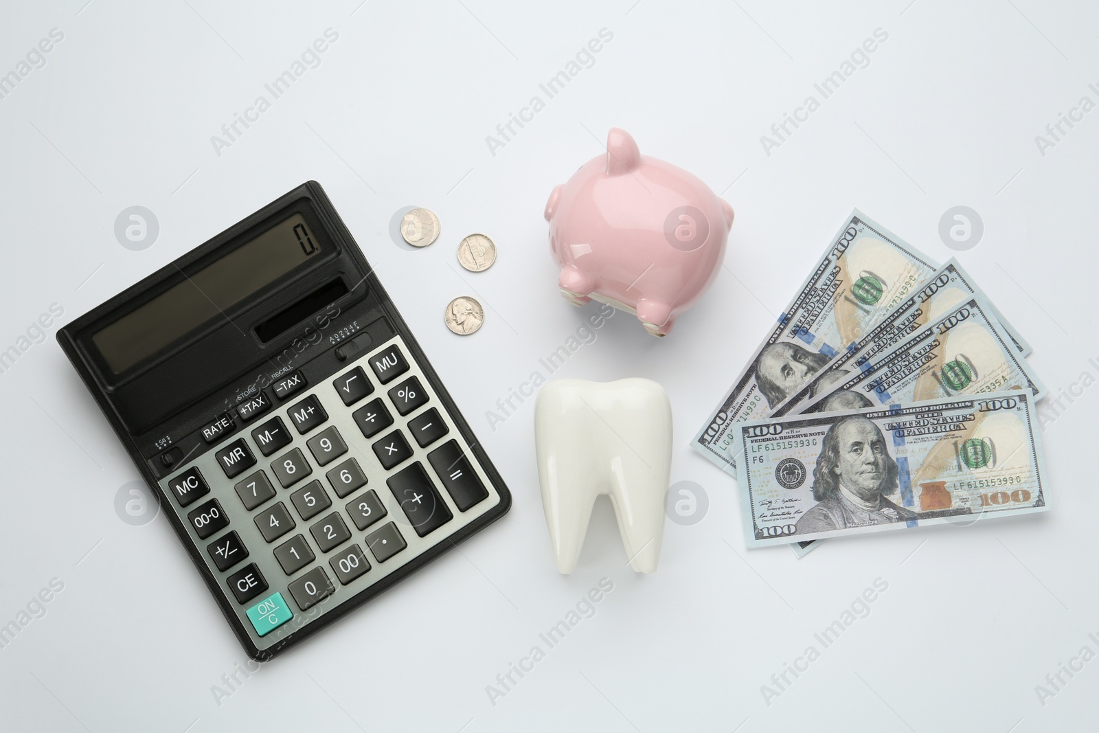 Photo of Flat lay composition with ceramic model of tooth and money on white background. Expensive treatment