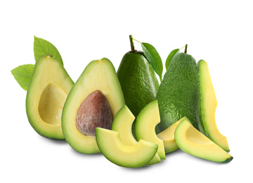 Cut and whole fresh avocados on white background