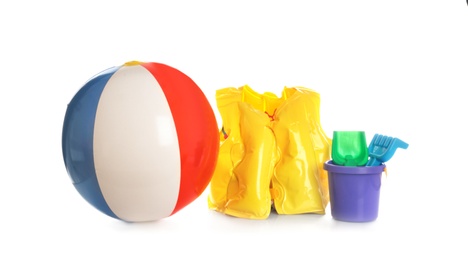 Photo of Inflatable vest and beach toys on white background