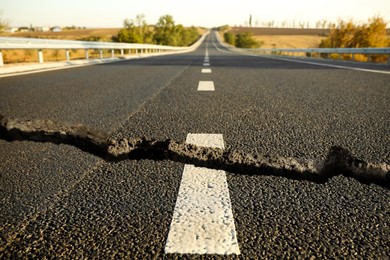 Large crack on asphalt road after earthquake