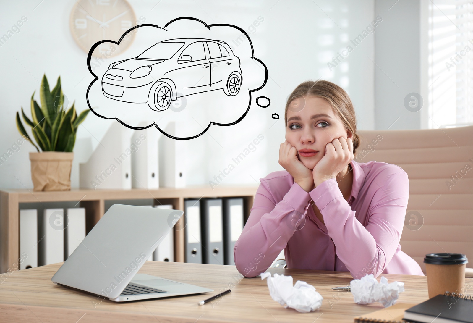 Image of Young woman dreaming about new car in office