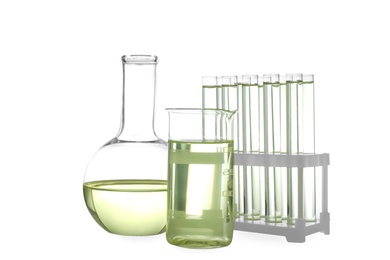 Photo of Glassware with liquids isolated on white. Laboratory analysis