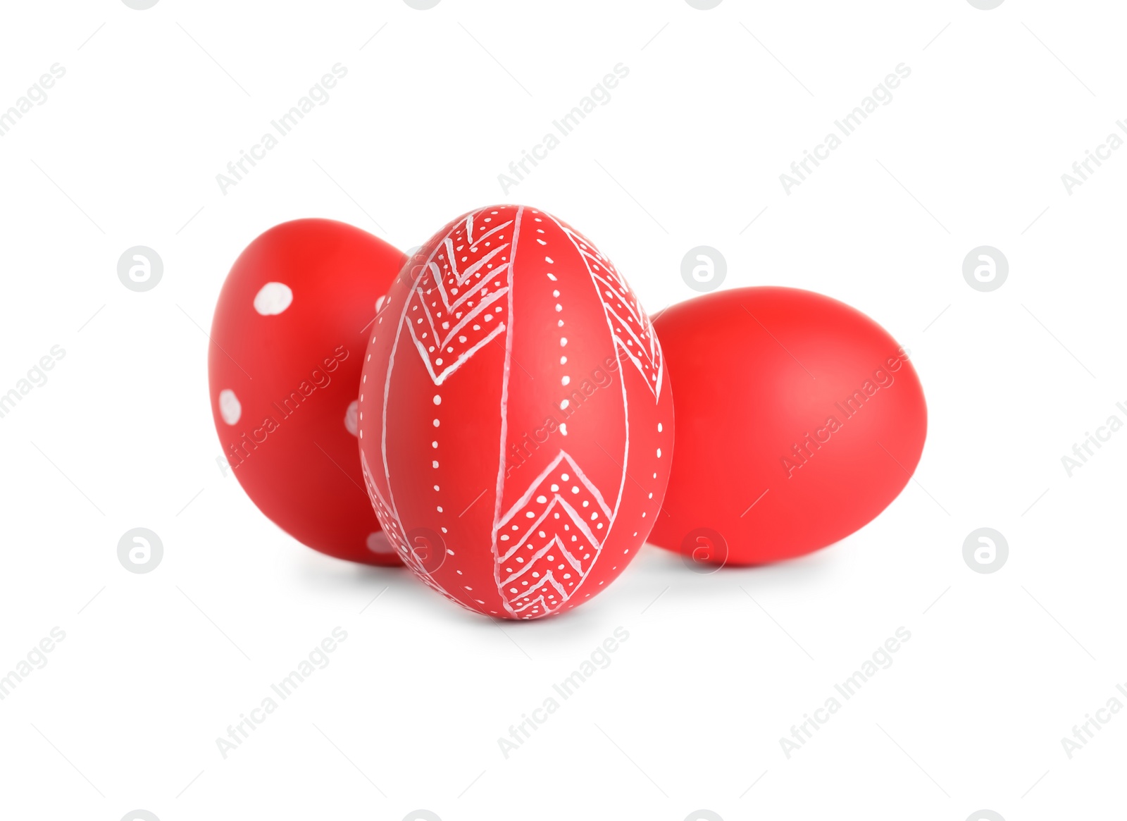 Photo of Creative painted red Easter eggs on white background