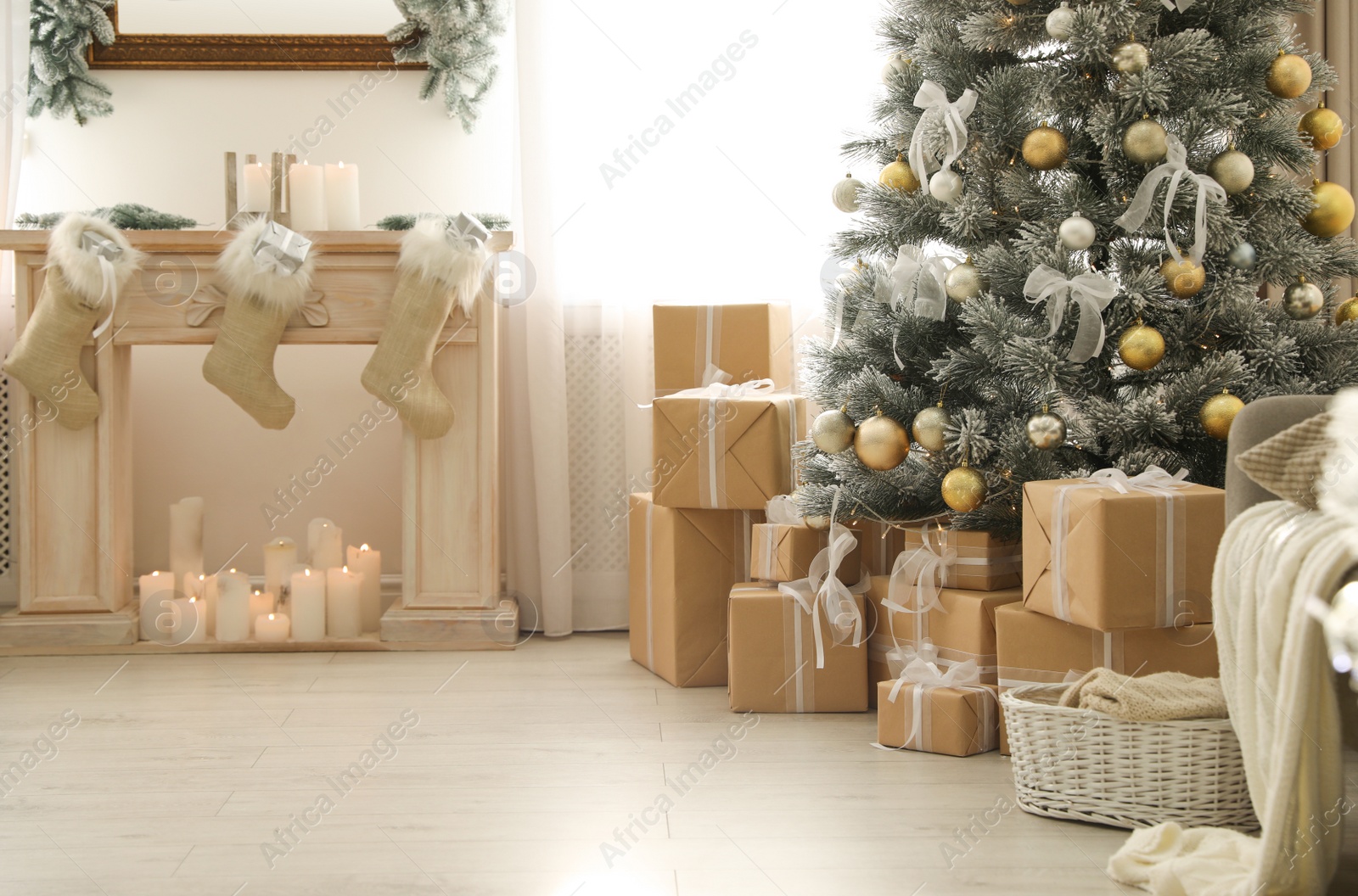 Photo of Stylish Christmas interior with beautiful decorated tree and fireplace