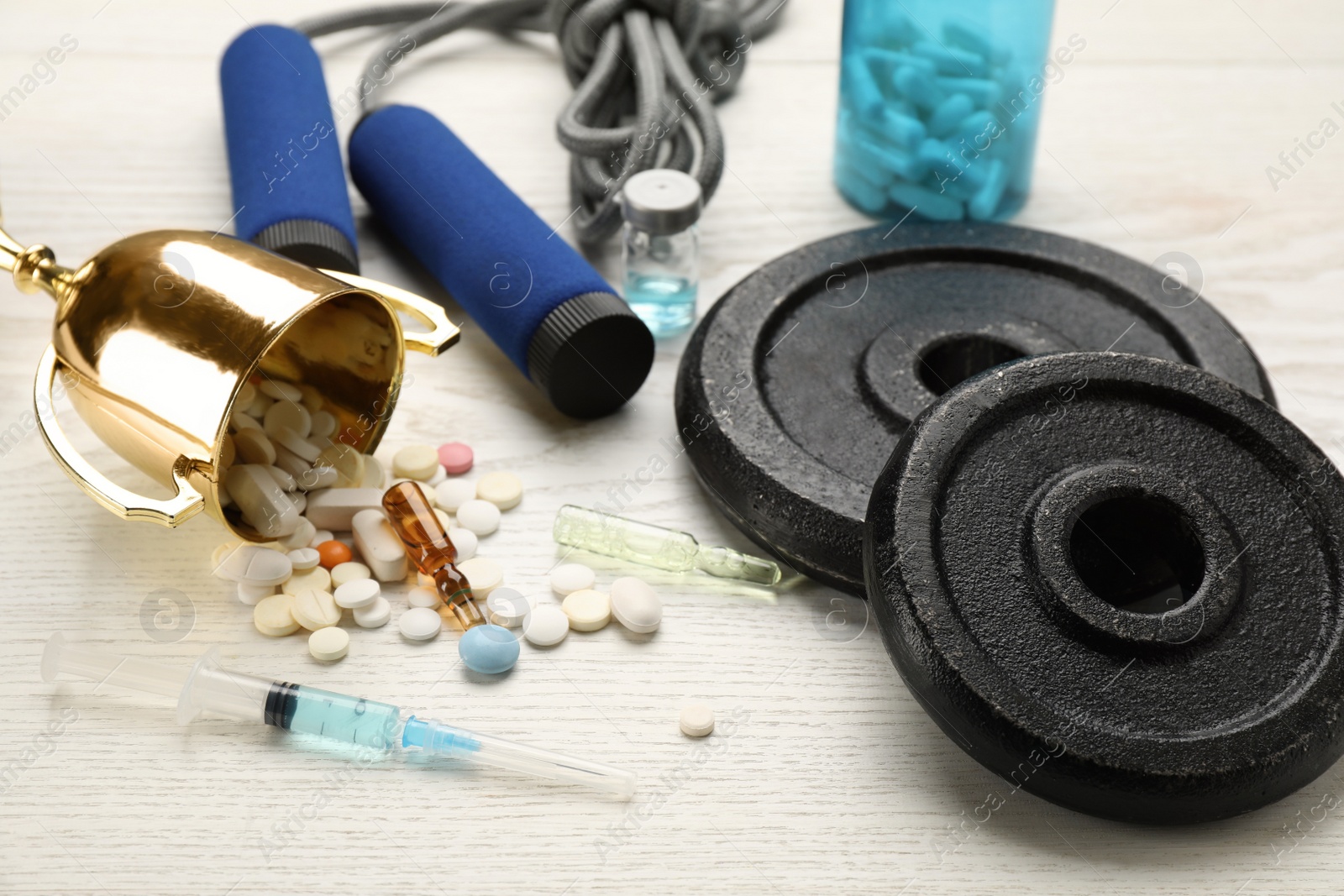 Photo of Composition with drugs on white wooden table. Doping control