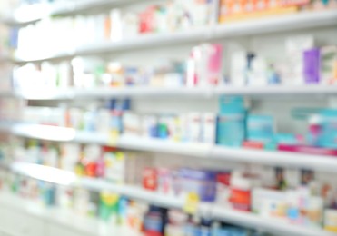 Shelves with pharmaceuticals in drugstore, blurred view