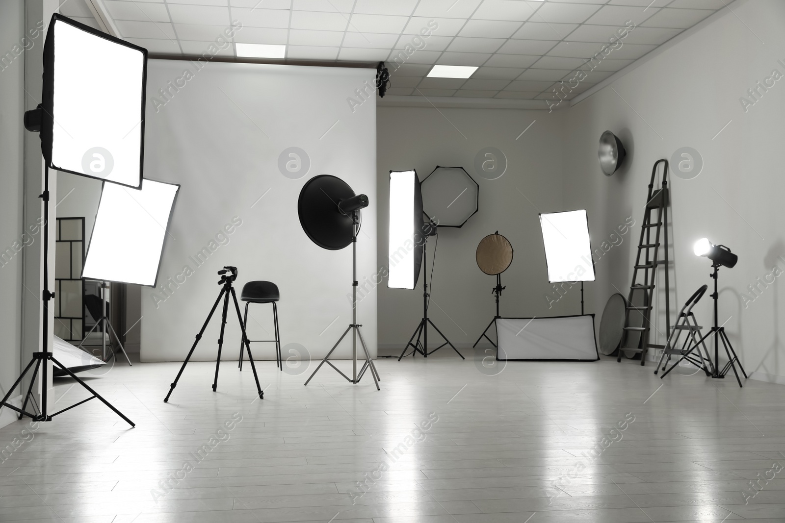 Photo of Interior of modern photo studio with professional equipment