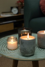 Lit candles on table in living room