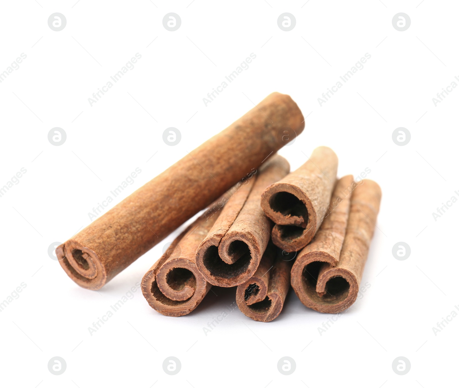 Photo of Aromatic cinnamon sticks on white background