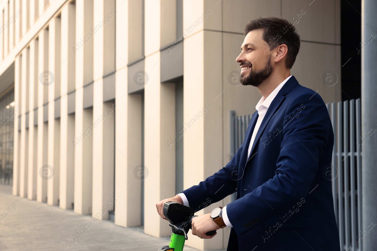 Photo of Businessman with modern kick scooter on city street, space for text