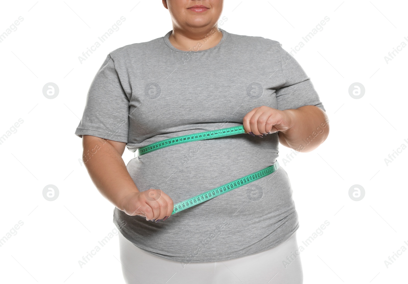 Photo of Overweight woman measuring waist with tape on white background, closeup