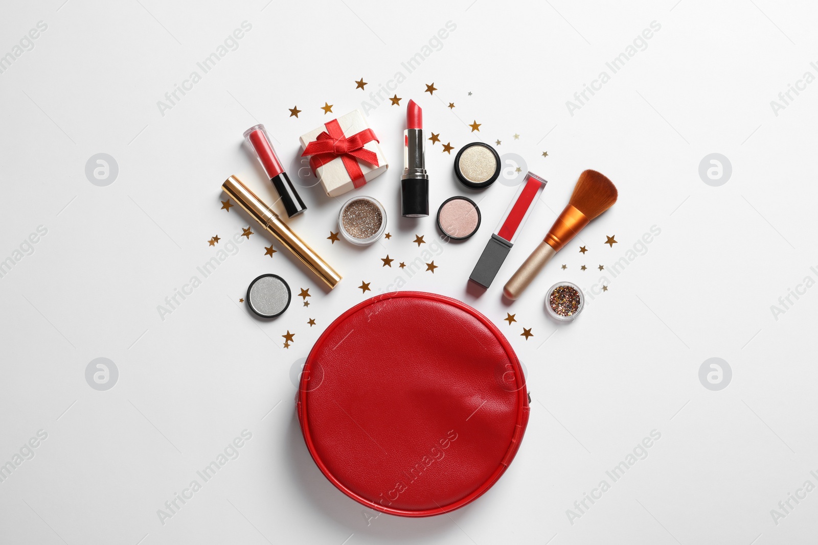 Photo of Flat lay composition with makeup products and Christmas decor on white background