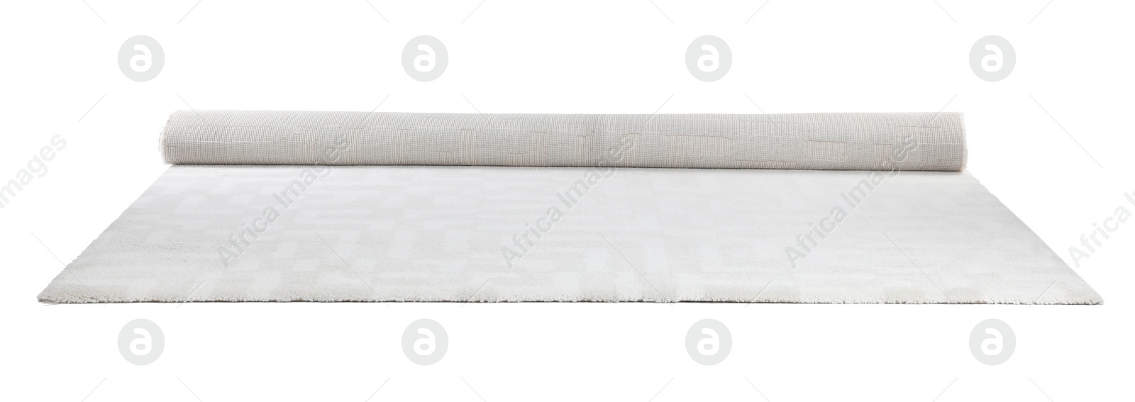 Photo of Rolled soft carpet on white background. Interior element