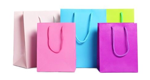 Photo of Colorful paper shopping bags isolated on white