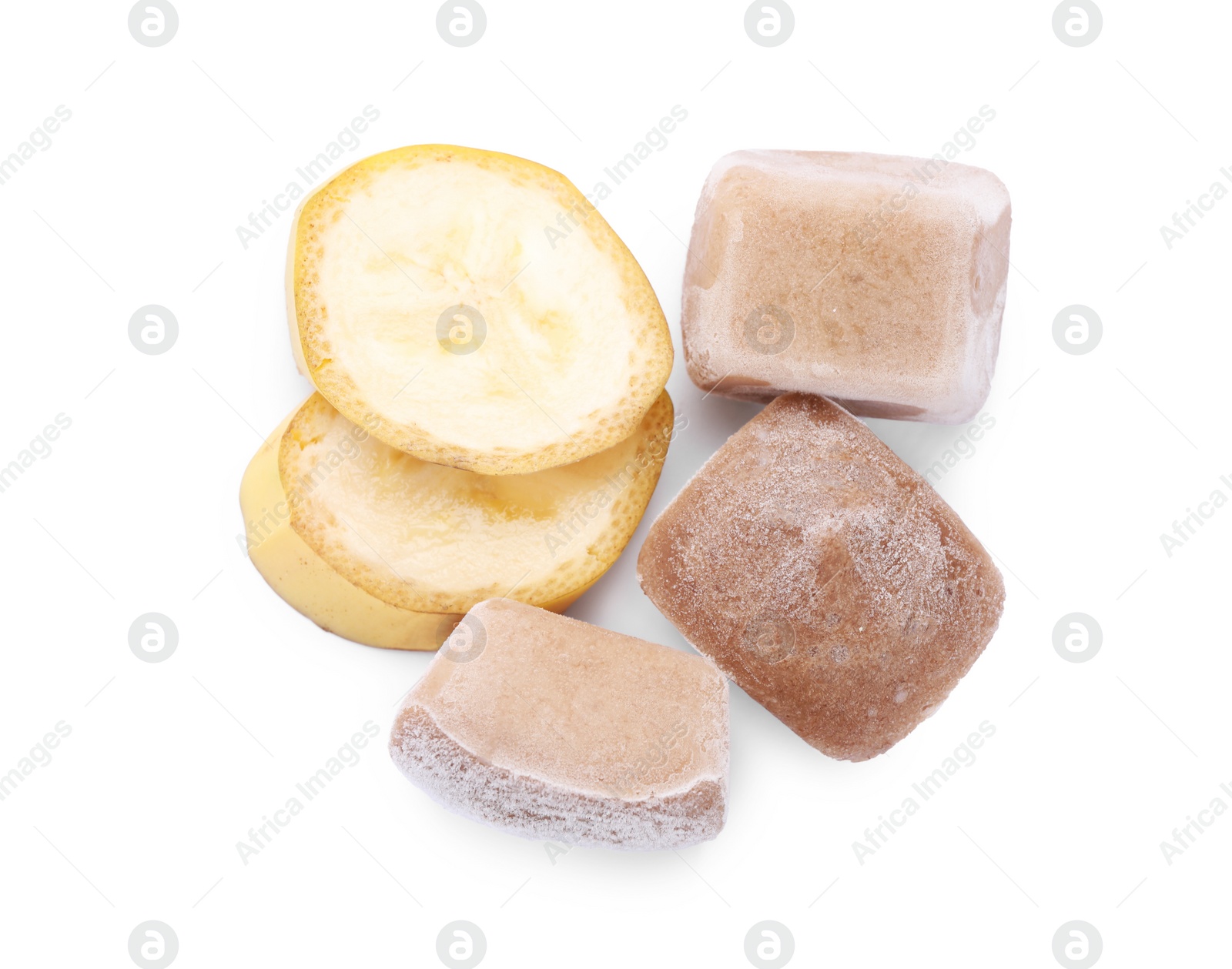 Photo of Frozen banana puree cubes and fruits on white background, top view