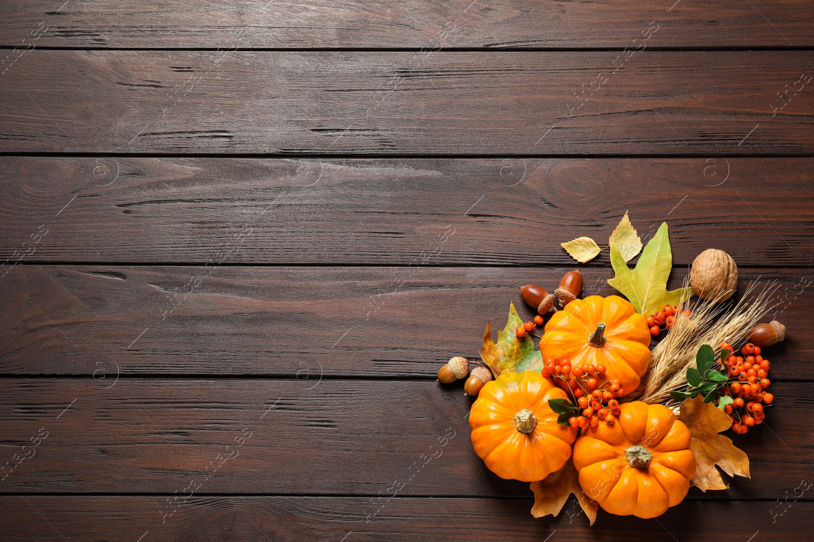 Photo of Flat lay composition with vegetables, berries and autumn leaves on wooden table, space for text. Thanksgiving Day