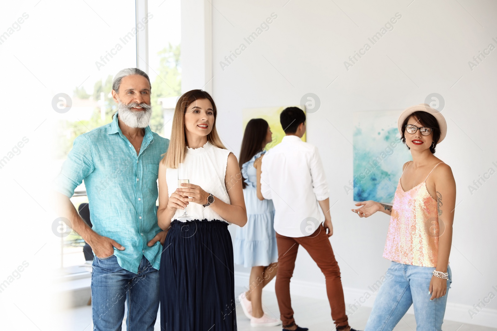 Photo of Group of people at exhibition in art gallery