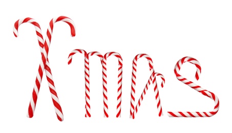 Image of Word Xmas of tasty candy canes on white background