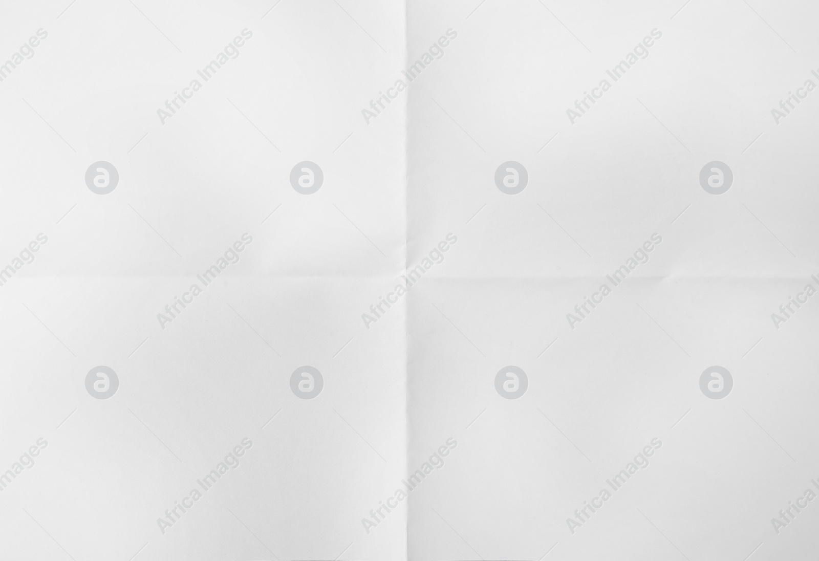 Photo of Sheet of folded white paper as background, top view