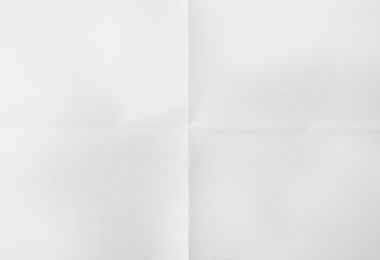 Sheet of folded white paper as background, top view