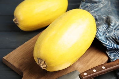 Photo of Whole ripe spaghetti squashes on wooden table