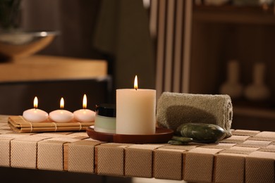 Beautiful composition with different spa products on wicker bench indoors