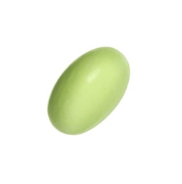 Photo of One light green pill on white background. Medicinal treatment