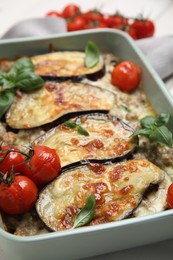 Photo of Delicious eggplant lasagna in baking dish, closeup