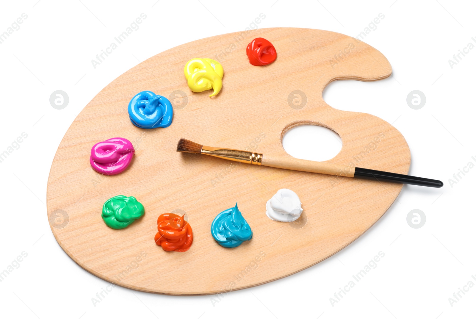 Photo of Palette with paints and brush on white background. Artist equipment