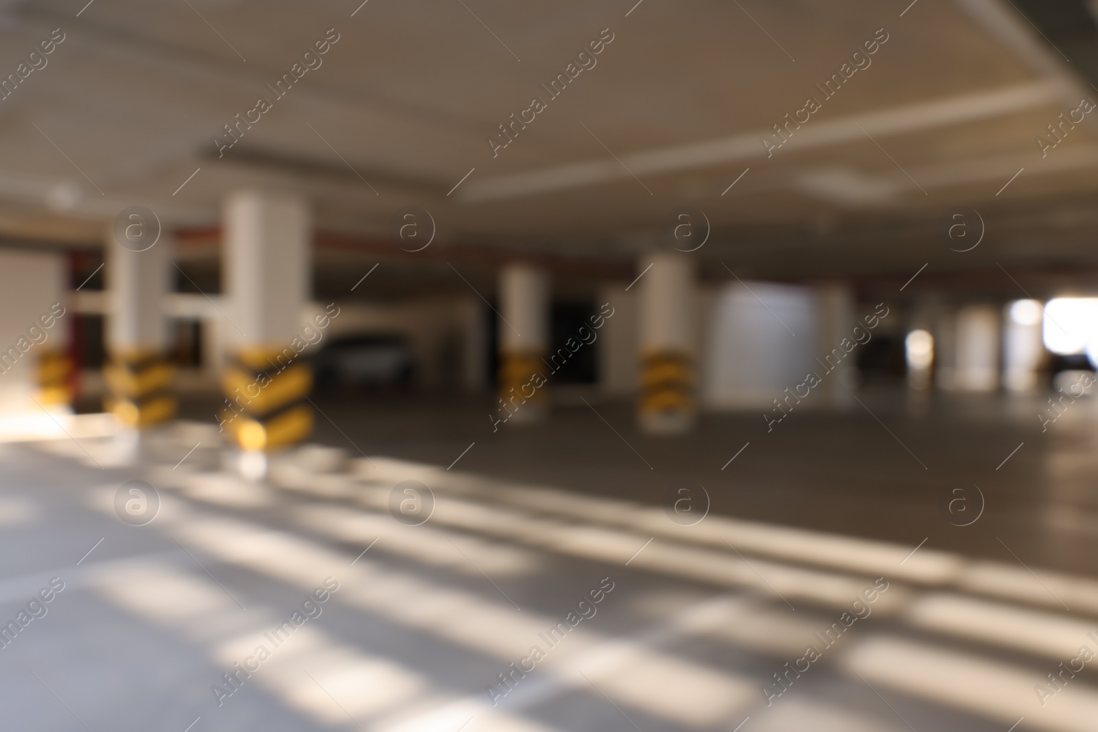 Photo of Blurred view of modern car parking garage