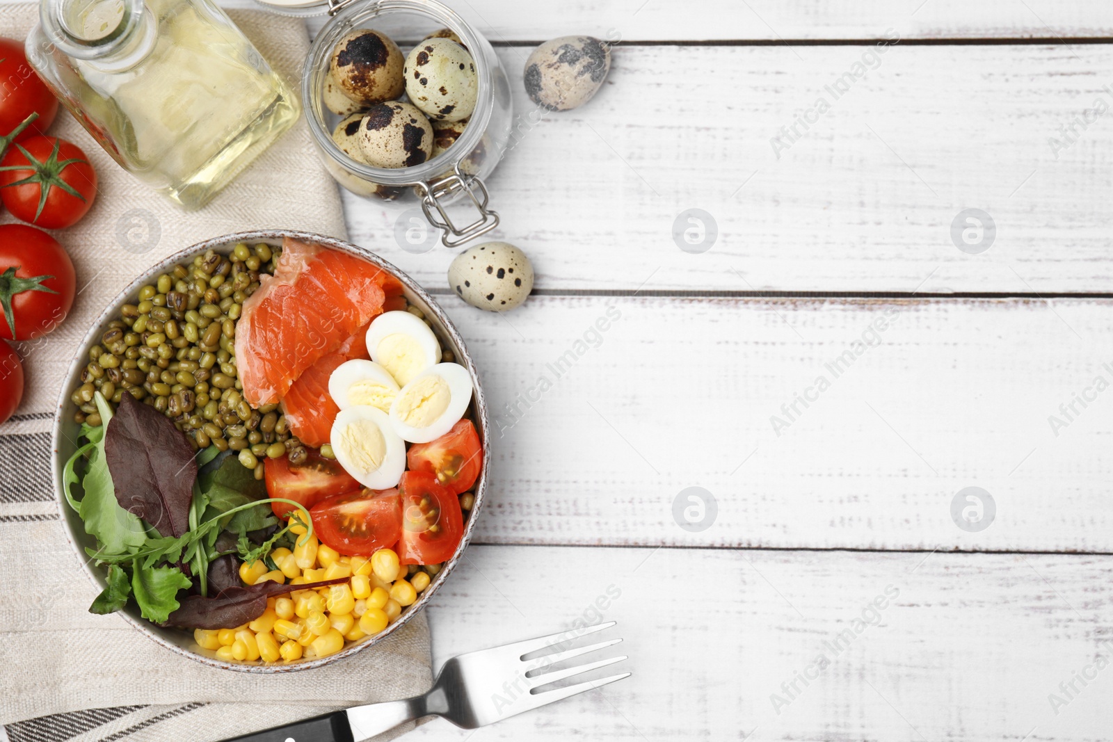 Photo of Bowl of salad with mung beans on white wooden table, flat lay