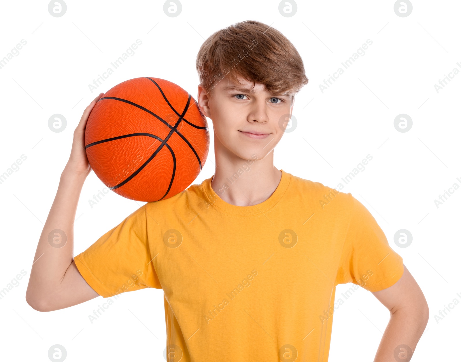 Photo of Teenage boy with basketball ball on white background