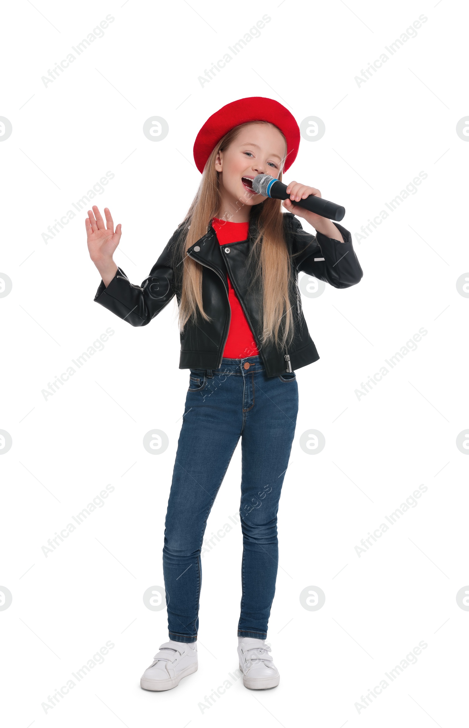 Photo of Cute little girl with microphone singing on white background