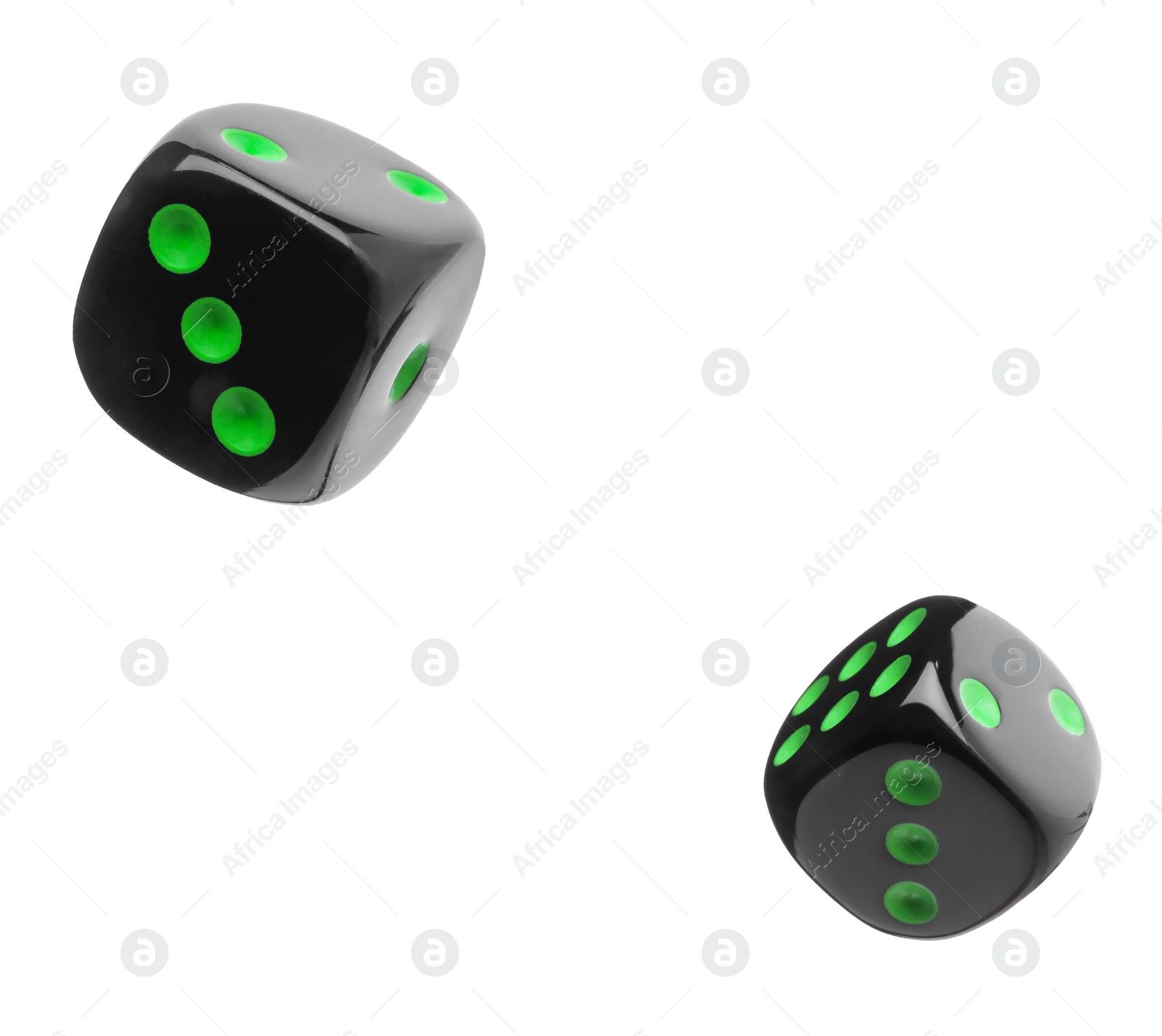 Image of Two black dice in air on white background