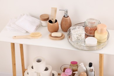 Different bath accessories and personal care products indoors