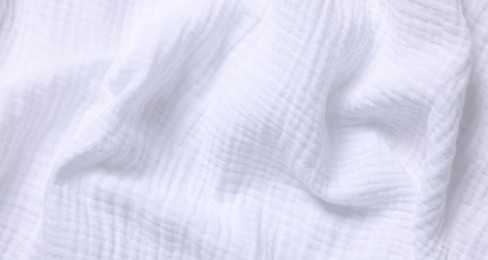 Texture of white crumpled fabric as background, top view